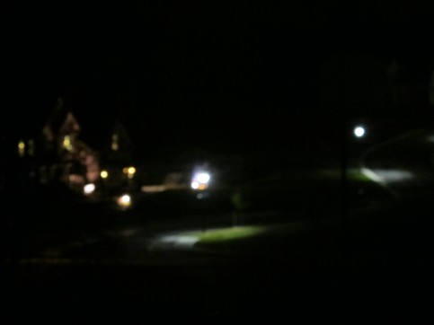 My new neighbors. A housing development I can see across the street. Streetlights ablaze, shining blue my window.